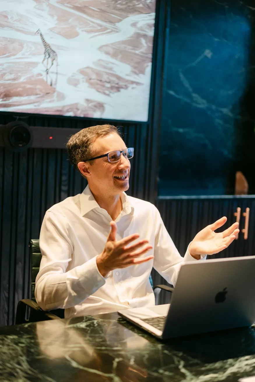 Paul Johnson discussing ideas at his desk